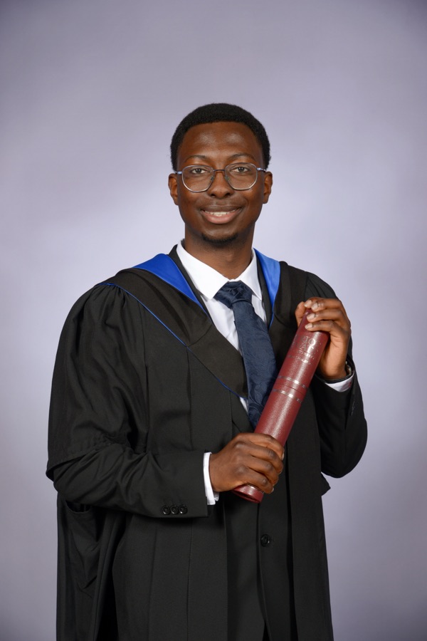 Portrait of TJ Adebayo at graduation